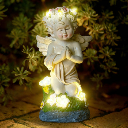 Pohabery solar angel statue glowing in the garden for peaceful evenings.