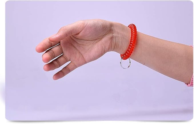 Ponjowl spiral wristband worn on the wrist for quick access to keys during activities.