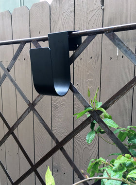 Poolmaster hose hanger mounts to solid surfaces for durable outdoor organization.