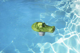 Poolmaster floating chlorine dispenser in pool provides continuous tablet release