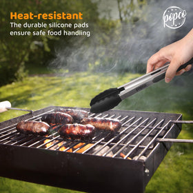 Popco heat-resistant tongs shown with pasta for cooking use.
