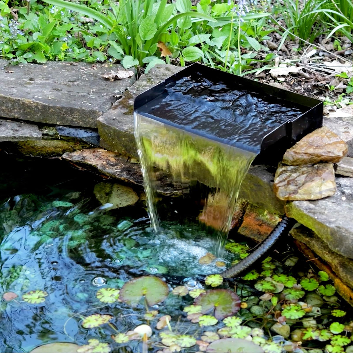 POPOSOAP pond pump 40W delivers steady flow for dramatic waterfall effects.