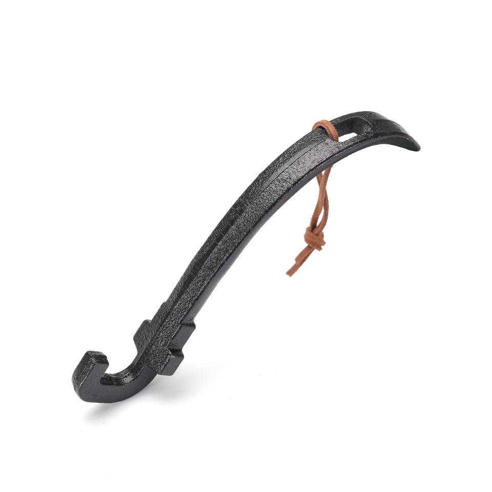 ppztkk Cast Iron Grill Lifter handle gripping a hot grate safely