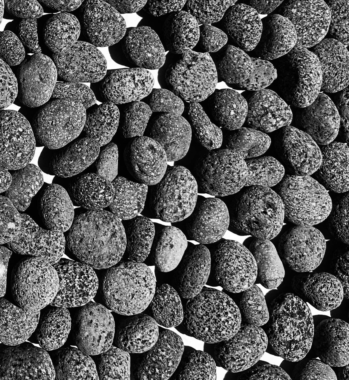 Premium Pebbles black lava rocks for fire pits showing heat-resistant decorative stone.