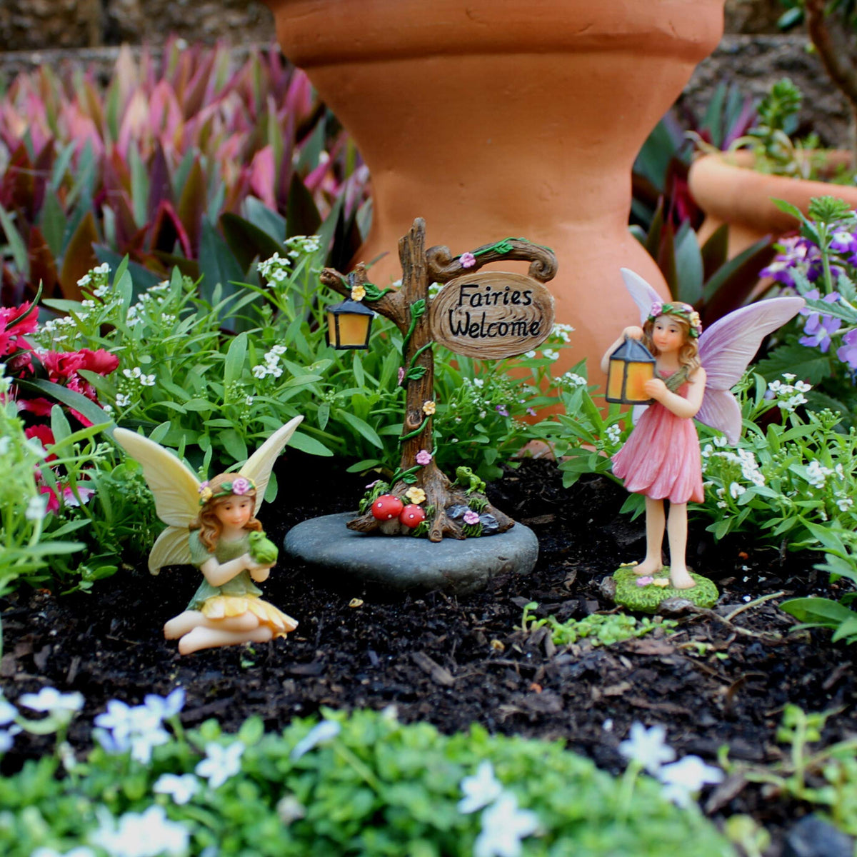 PRETMANNS Welcome sign among fairies adds a welcoming focal point.