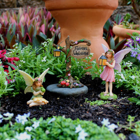PRETMANNS Welcome sign among fairies adds a welcoming focal point.