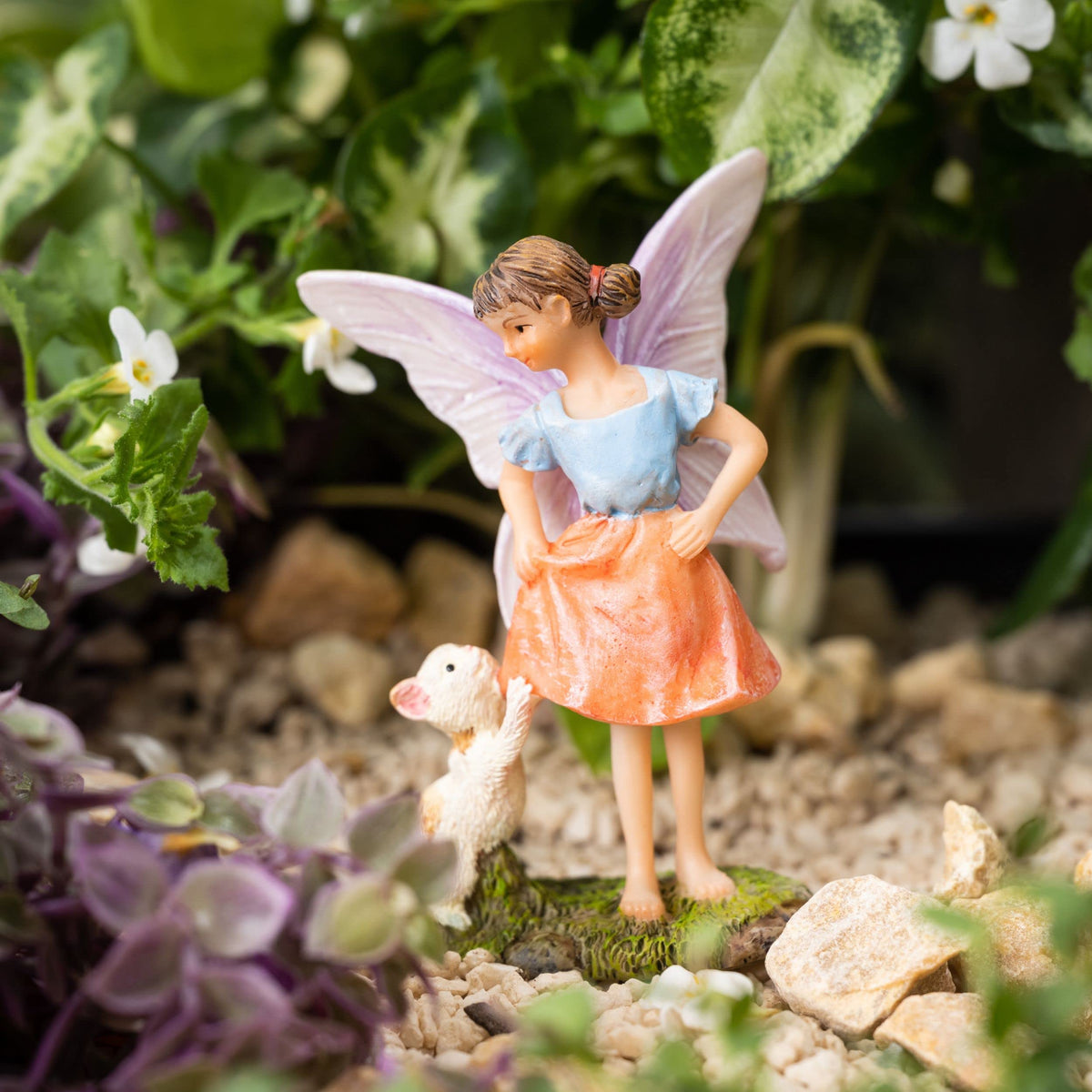 PRETMANNS fairy garden swing decor complements other village accessories.