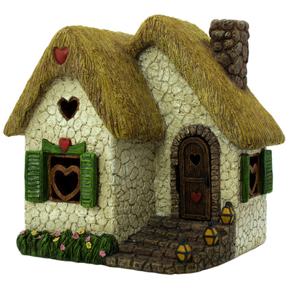 Pretmanns seven-inch outdoor fairy house with opening door enhances garden whimsy