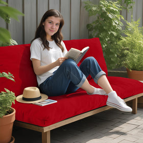 PrimePATIO red cushion in rainy outdoor setting.
