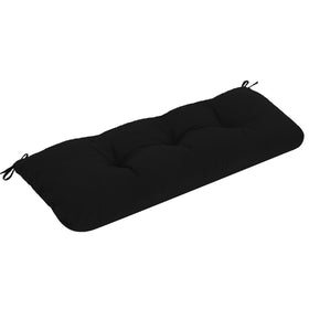 PrimePATIO outdoor bench cushion on wicker chair, waterproof and tufted for all-weather use.