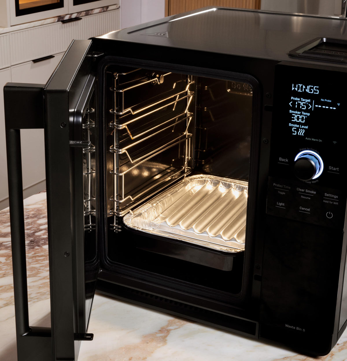 GE Profile Indoor Smoker liners in use catch drips and protect the tray.