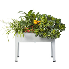 ProGard raised garden bed with legs on a grey balcony for easy herb cultivation.