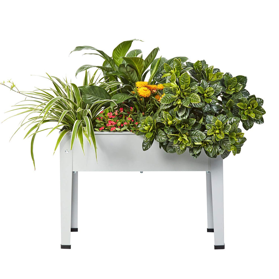 ProGard raised garden bed with legs on a grey balcony for easy herb cultivation.