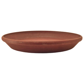 Terracotta PSW saucer under a potted plant on a table.