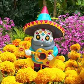 Close-up of Pueblita El Mariachi details showing artisan-inspired colors.