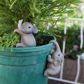 Pujipu garden decor figurine brightens patios and garden edges.