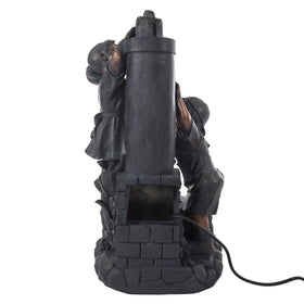 Pure Garden fountain placed in a garden setting showing durable polyresin construction