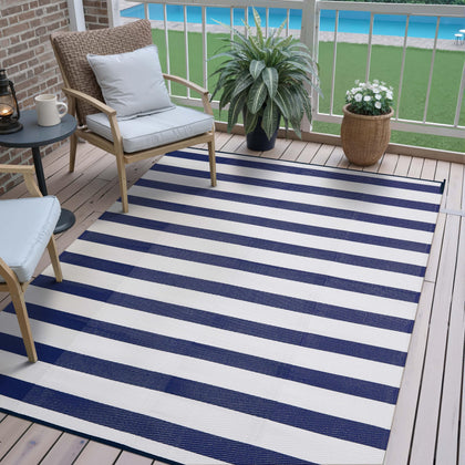 PureCozy outdoor rug with navy blue stripes for patios and decks.