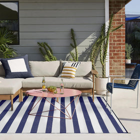 PureCozy UV-coated rug resists fading for year-round outdoor use.