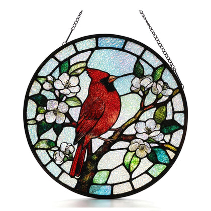 PURRGIFTS round cardinal diamond glass suncatcher with red bird on branch glowing in sunlight.