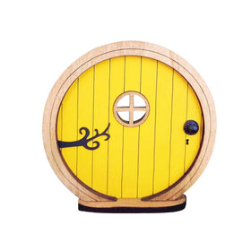 PurYupearl fairy door on a tree trunk adds whimsy to outdoor decor.