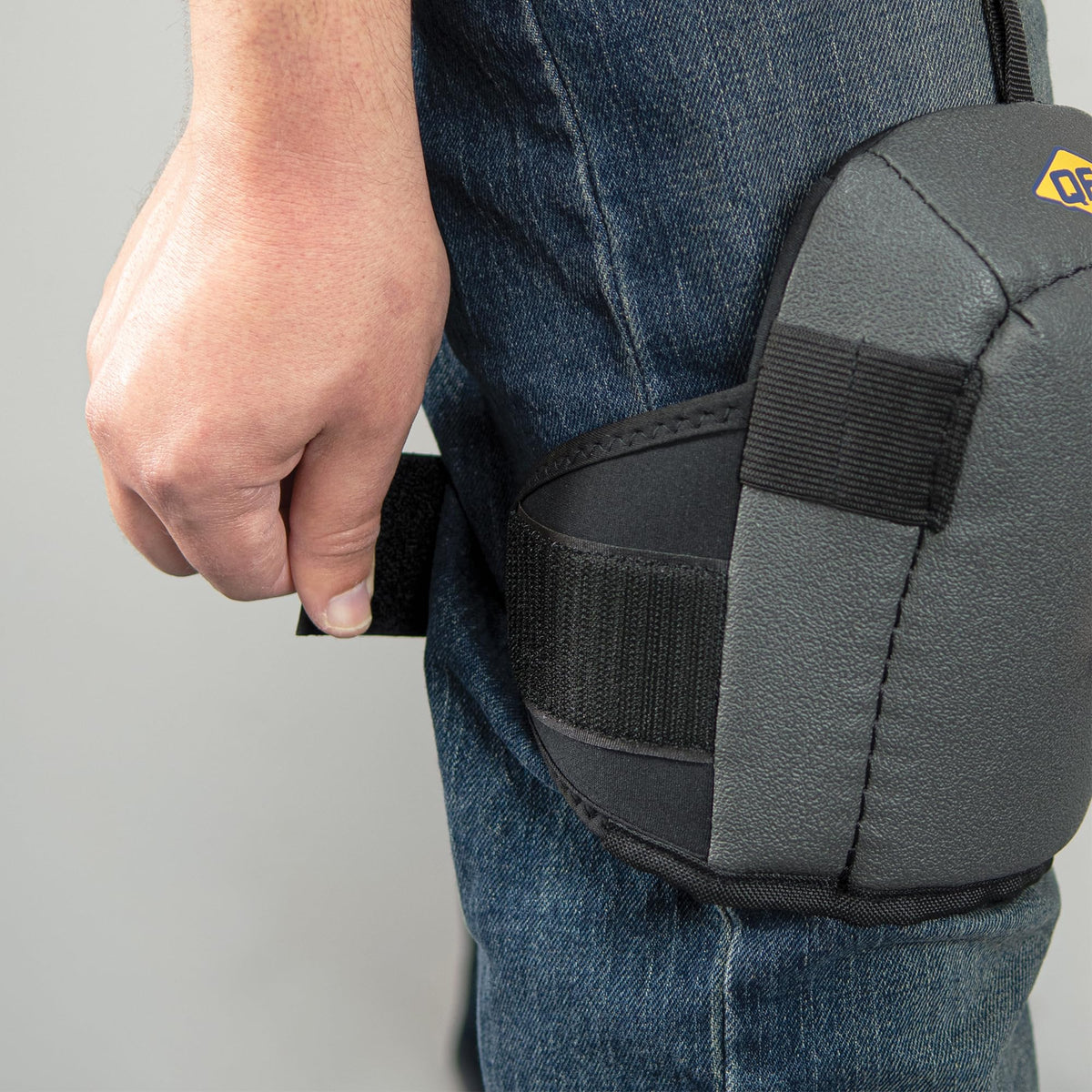 Adjustable hook-and-loop strap keeps QEP knee pads securely in place.