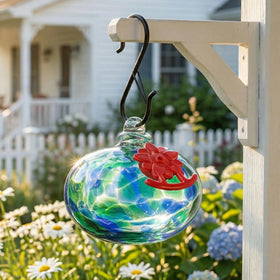 QFkris blown glass hummingbird feeder in green adds elegant outdoor color.