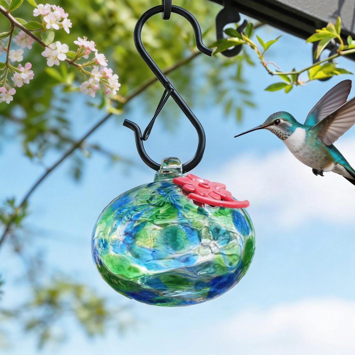 QFkris hummingbird feeder shows interchange option with flower-spout.