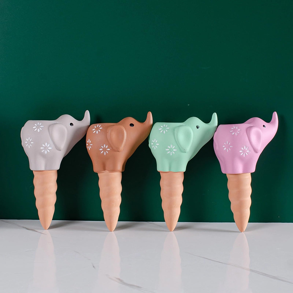 QinSuiKai elephant-shaped terracotta spike delivers steady water to indoor plants.