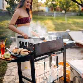 Qinshaine tongs-in-use-grilling shows flipping without dropping food.