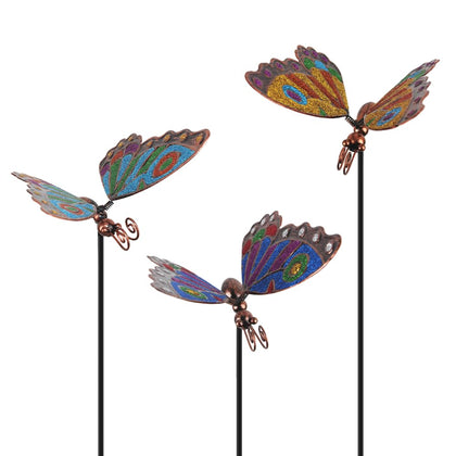 Qipade butterfly garden stake close-up showing hand-painted glittery wings for sunny beds.