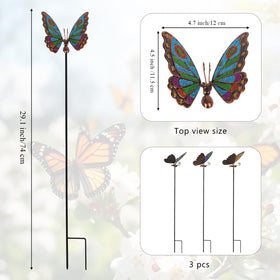Qipade butterfly garden stake placed in flower bed adding bright color.