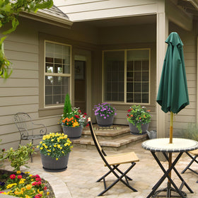 Quarut sturdy recyclable plastic pot offers weather resistance for year-round gardening