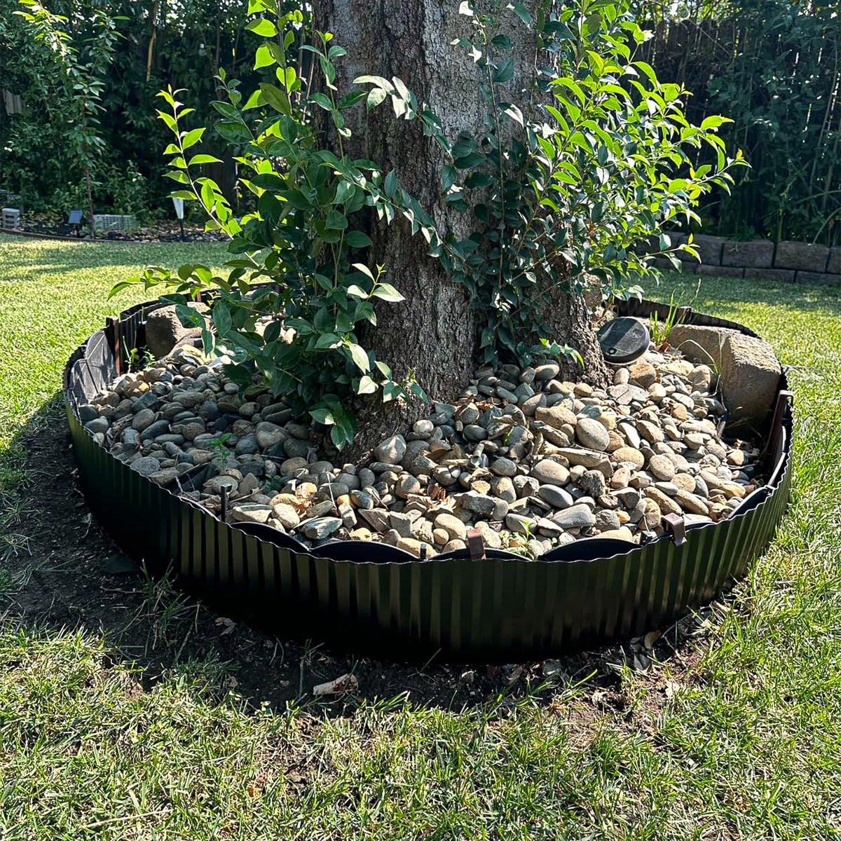 Quibbay black or silver border complements garden designs.