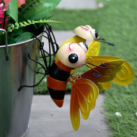 QZLOHOM bee sculpture with orange wings, adds playful climbing decor to trees.
