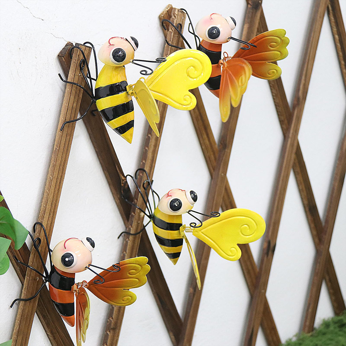 QZLOHOM bee sculpture with yellow wings, ideal for vibrant outdoor garden accents.