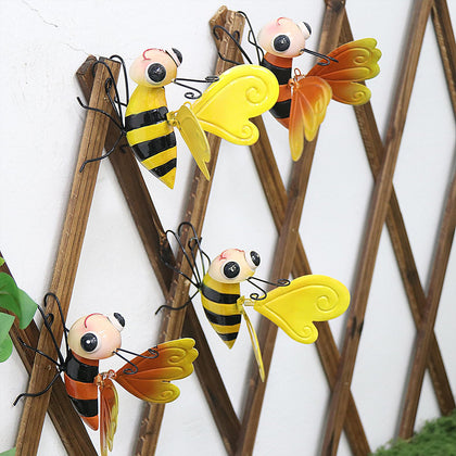 QZLOHOM bee sculpture with yellow wings, ideal for vibrant outdoor garden accents.