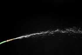 Rain Bird HENZLB5ADJ nozzle in outdoor cleaning scenario illustrating versatile utility.