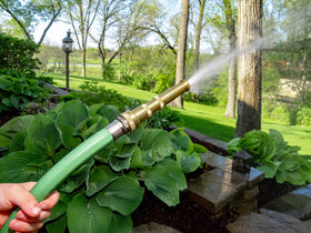 Rain Bird HENZLB5ADJ twist-dial grip demonstrates easy pattern changes on an adjustable nozzle.