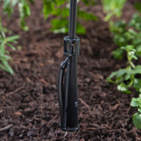 Raindrip stake close-up showing barbed inlet for easy 1/4-inch tubing connection