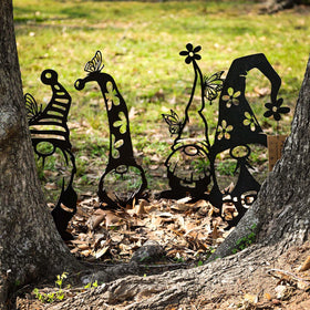 RealSteel metal garden gnomes 4-pack on stakes brighten the yard and path.