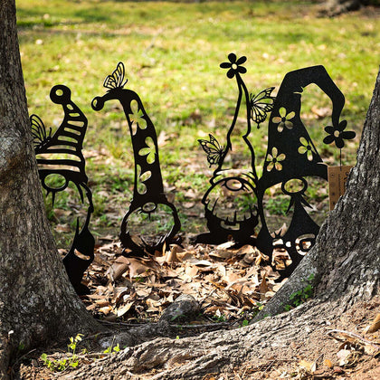 RealSteel metal garden gnomes 4-pack on stakes brighten the yard and path.