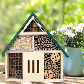 Rebecca Online bee house in a lush backyard garden scene