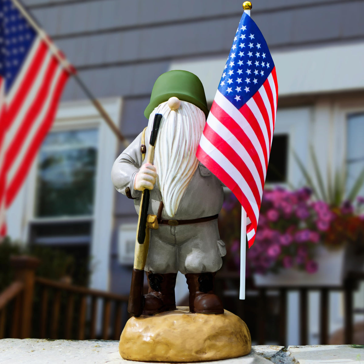 Redwix hand-painted patriotic gnome holds flag, adding character to yard decor.