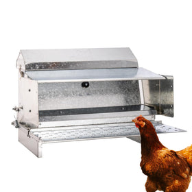RentACoop automatic treadle feeder outdoors with weatherproof design and 25lb capacity.