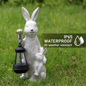 REYISO rabbit figurine on porch illuminates paths with solar power.