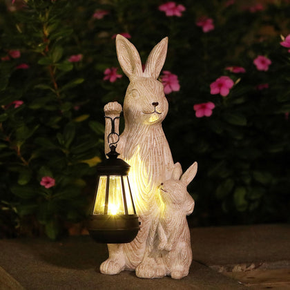 REYISO solar garden bunny statue with LED lights for cozy outdoor evenings.