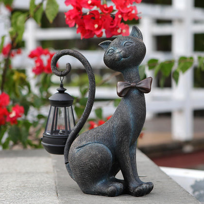REYISO whimsical cat statue with solar light, front view for charming outdoor entry