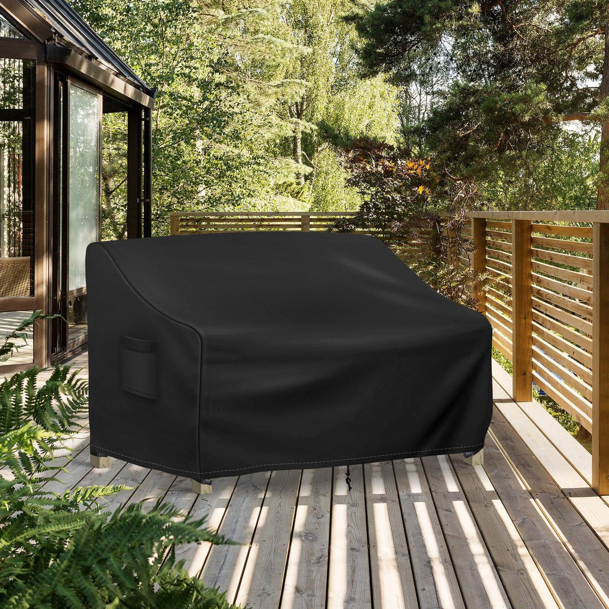 Richwon black patio couch cover in use under light drizzle.