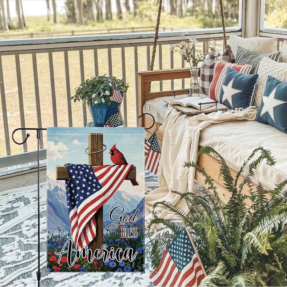 RMXJKIIU cardinal bird garden flag in a lush yard.